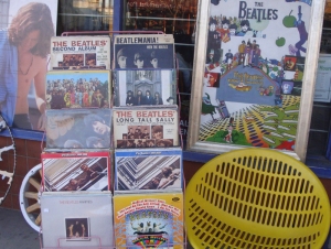 Beatles LP records and Beatles poster at a second hand shop in Vernon Canada